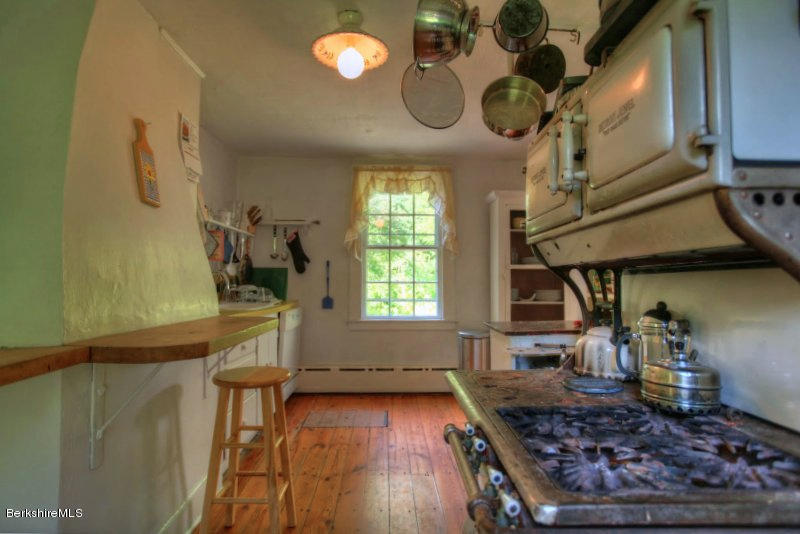 66 Fox Road Sandisfield, MA 01255 - Photo 20 of 54 a kitchen with wooden floors and a stove