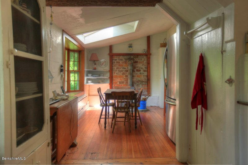 66 Fox Road Sandisfield, MA 01255 - Photo 22 of 54 a dining room with furniture entryway and wooden floor