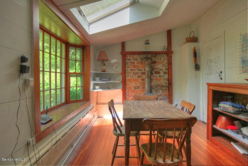 66 Fox Road Sandisfield, MA 01255 - Photo 24 of 54 a view of a dining room with furniture window and wooden floor