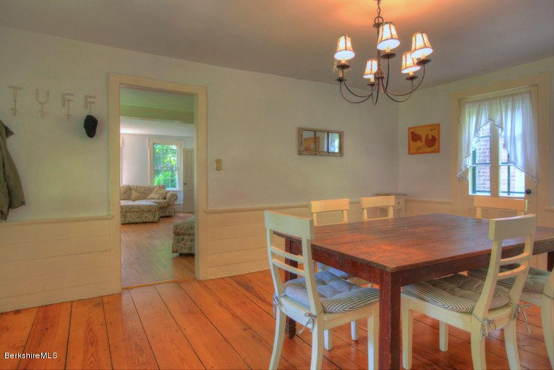 66 Fox Road Sandisfield, MA 01255 - Photo 26 of 54 a view of a dining room with furniture and wooden floor