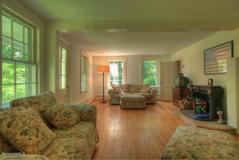 66 Fox Road Sandisfield, MA 01255 - Photo 27 of 54 a living room with furniture and a wooden floor