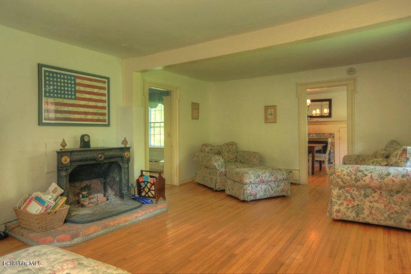 66 Fox Road Sandisfield, MA 01255 - Photo 28 of 54 a bedroom with furniture and a wooden floor