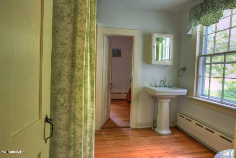 66 Fox Road Sandisfield, MA 01255 - Photo 29 of 54 a bathroom with a sink and a mirror