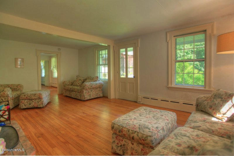 66 Fox Road Sandisfield, MA 01255 - Photo 32 of 54 a spacious bedroom with a bed and a couch