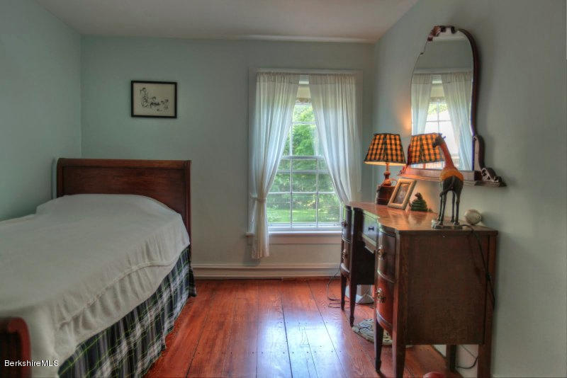 66 Fox Road Sandisfield, MA 01255 - Photo 36 of 54 a bed sitting in a bedroom next to a window