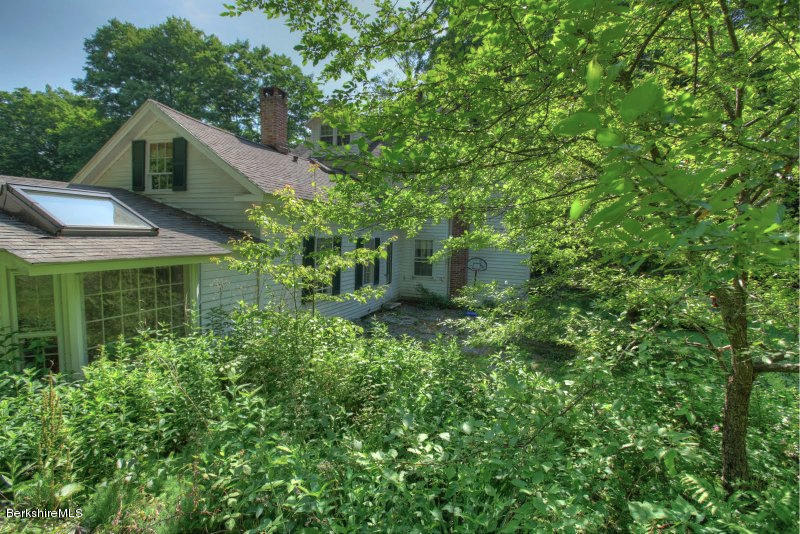 66 Fox Road Sandisfield, MA 01255 - Photo 49 of 54 a front view of a house with a yard and tree