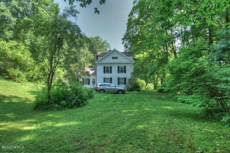 66 Fox Road Sandisfield, MA 01255 - Photo 50 of 54 a front view of a house with a garden