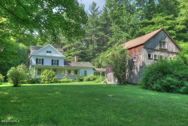 66 Fox Road Sandisfield, MA 01255 - Photo 53 of 54 a front view of a house with a yard and green space