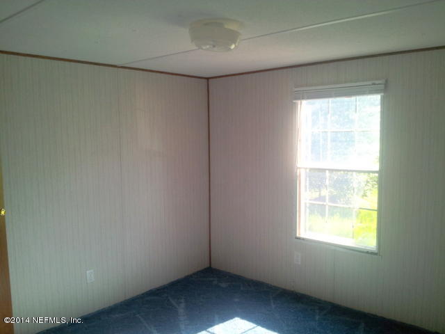 4127 Bronco Road Middleburg, FL 32068 - Photo 9 of 13 a view of an empty room with a window