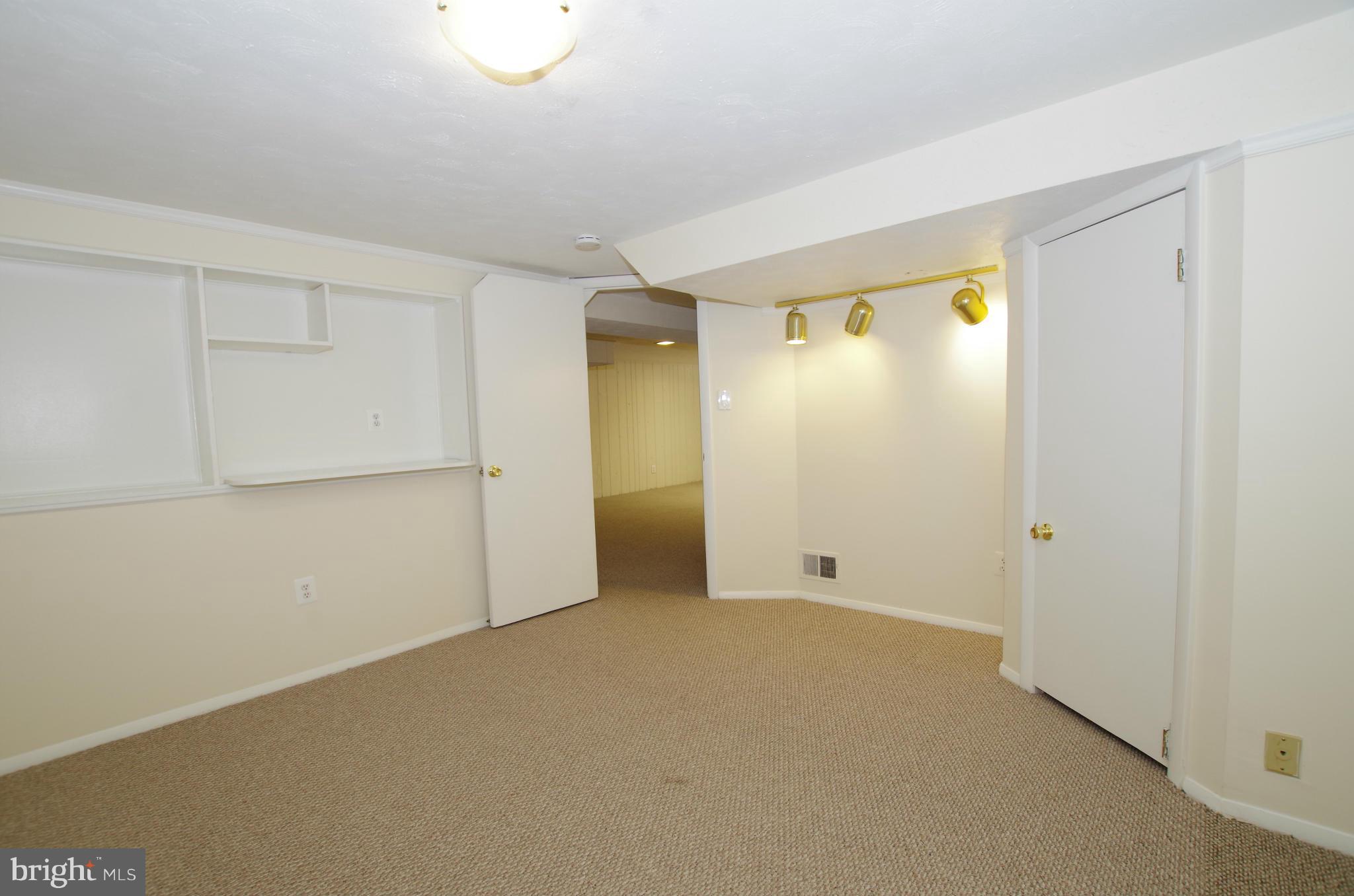 12624 Epping Road Silver Spring, MD 20906 - Photo 23 of 30 Lower Level Bonus Room with Built In Shelves