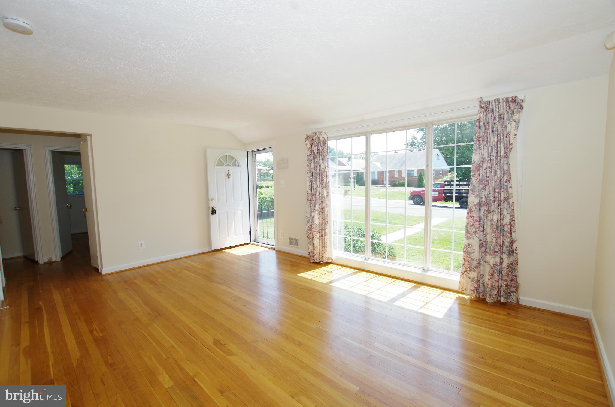 12624 Epping Road Silver Spring, MD 20906 - Photo 7 of 30 Living Room with Sunlit Picture Window