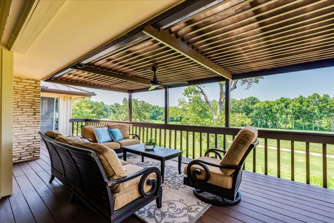 The covered patio deck overlooks the golf course and Onion Creek