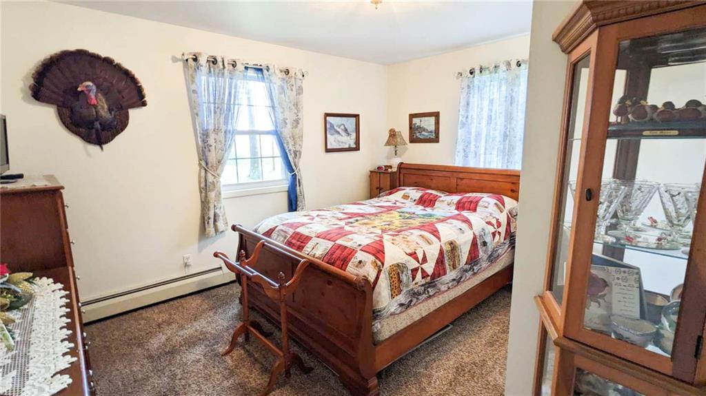 2646 Ridge Road Westover, PA 16692 - Photo 12 of 23 a bedroom with a bed a dresser and a large mirror
