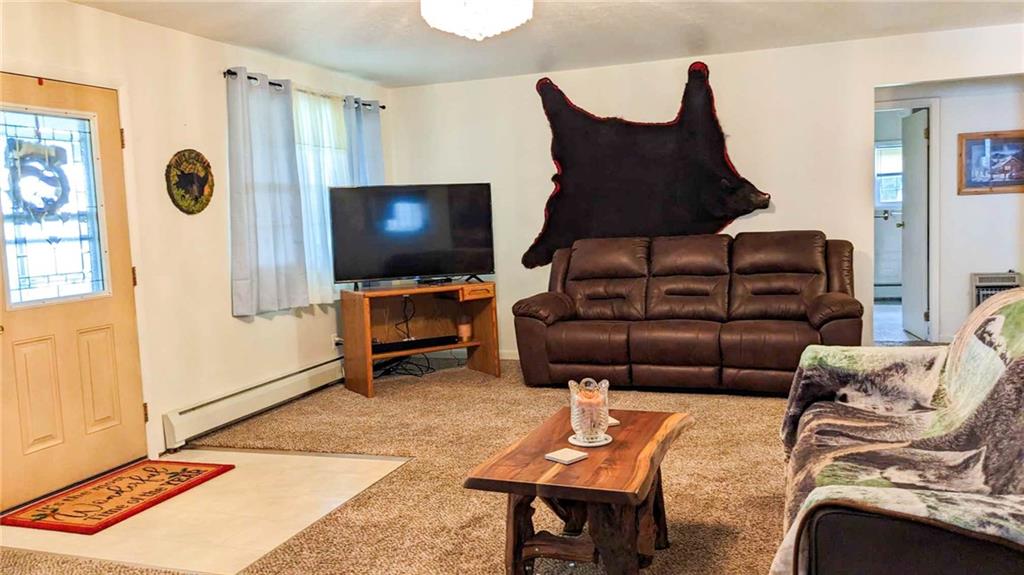 2646 Ridge Road Westover, PA 16692 - Photo 10 of 23 a living room with furniture a flat screen tv and a table