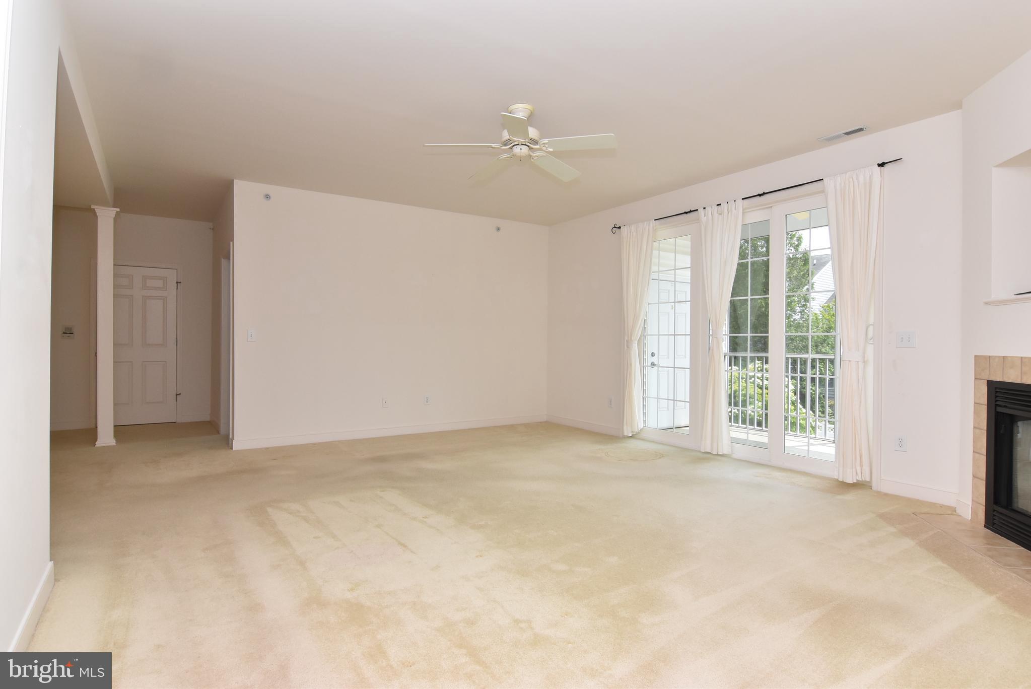 30619 Cedar Neck Road, Unit 1212 Ocean View, DE 19970 - Photo 13 of 57 Living room to screened-in porch