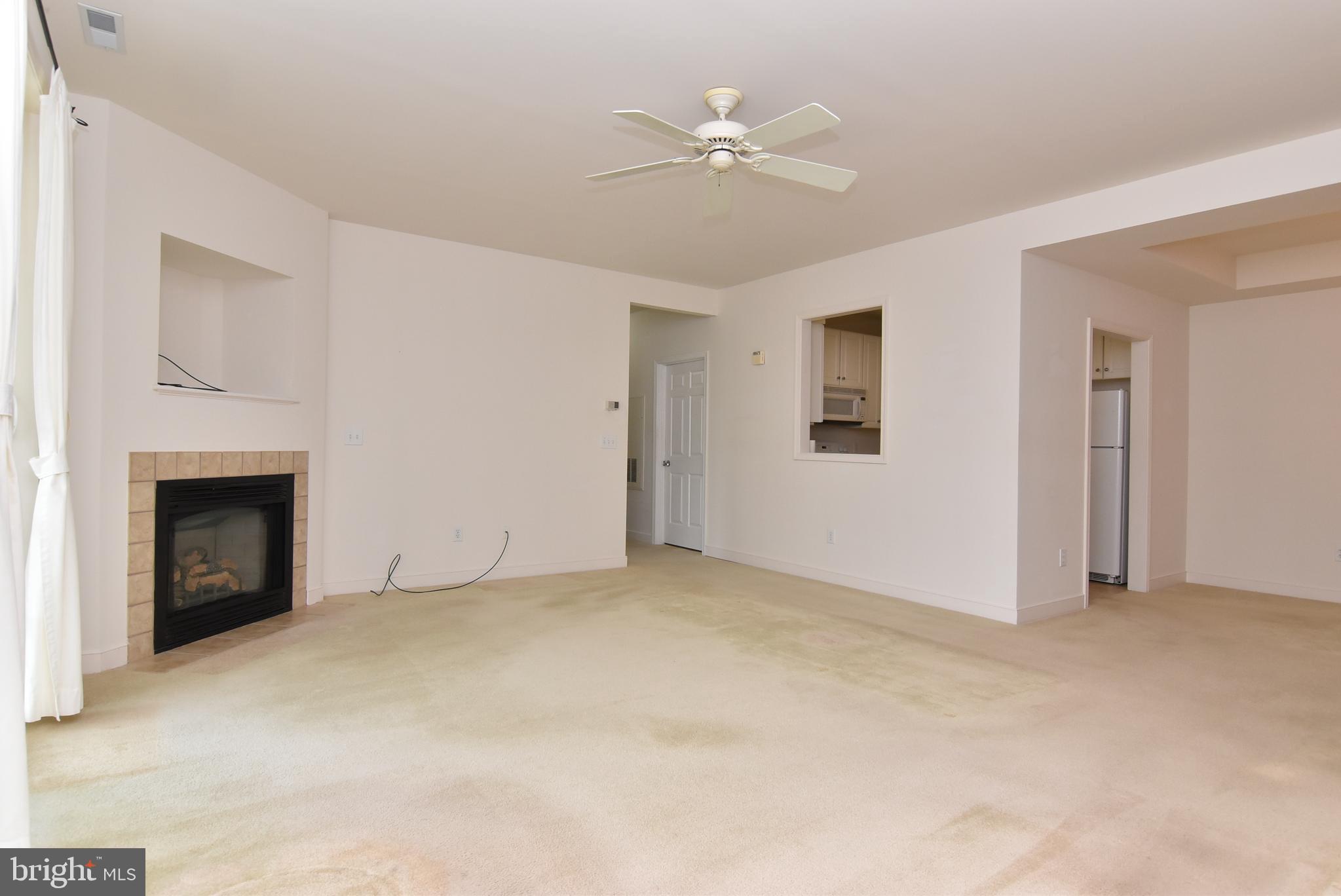 30619 Cedar Neck Road, Unit 1212 Ocean View, DE 19970 - Photo 6 of 57 Living room with fireplace