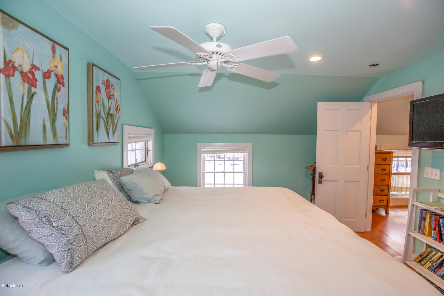 3 Tyringham Road Monterey, MA 01245 - Photo 16 of 24 a bedroom with a large bed and a chandelier