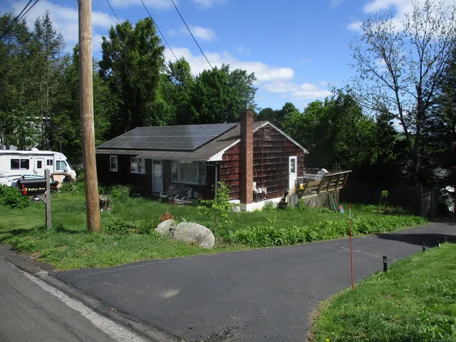 a aerial view of a house with a yard