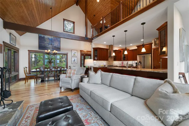 a kitchen with stainless steel appliances granite countertop a refrigerator a sink and a stove