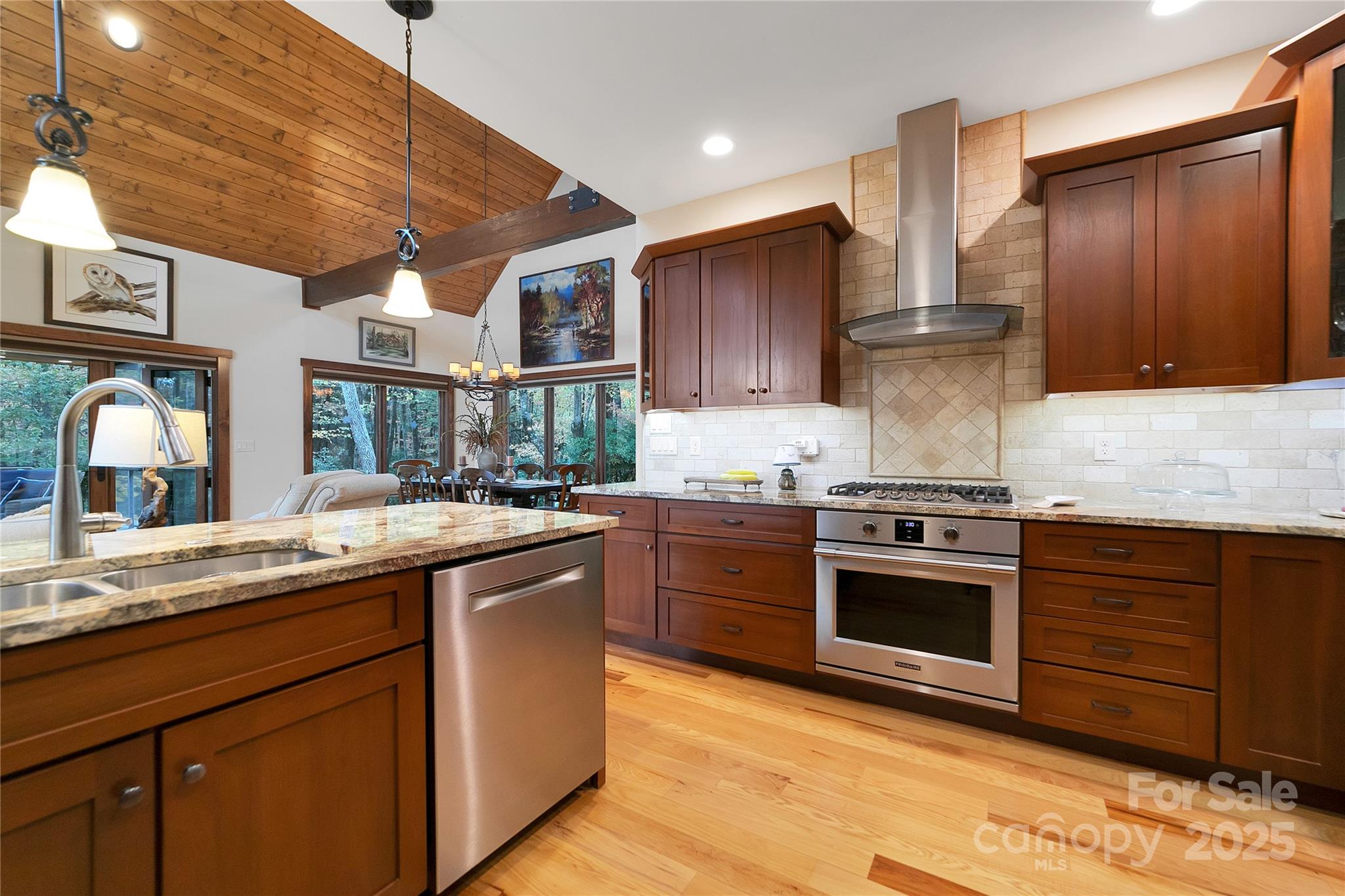 1291 Indian Camp Mountain Road Rosman, NC 28772 - Photo 14 of 48 a kitchen with stainless steel appliances granite countertop a stove a sink and a refrigerator