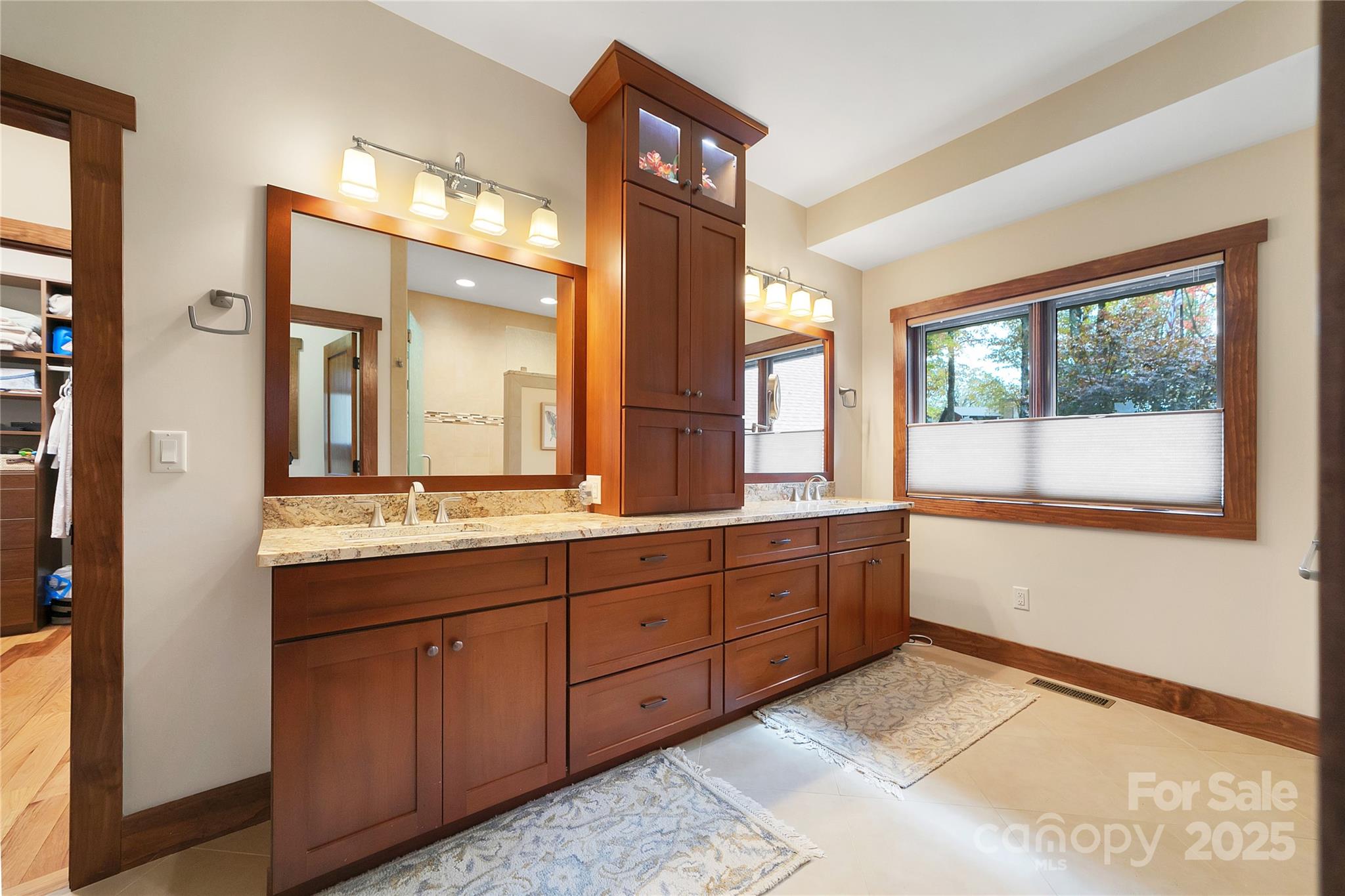 1291 Indian Camp Mountain Road Rosman, NC 28772 - Photo 23 of 48 a spacious bathroom with double vanity and a large mirror