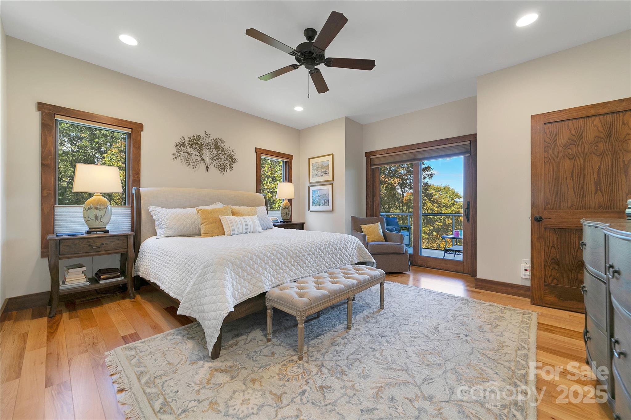 1291 Indian Camp Mountain Road Rosman, NC 28772 - Photo 24 of 48 a spacious bedroom with a bed and a table in it