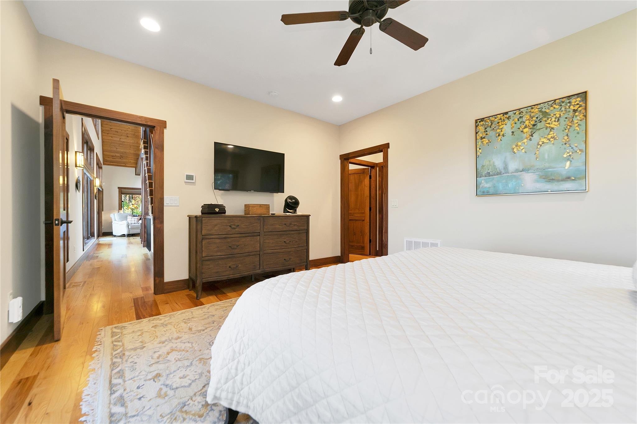 1291 Indian Camp Mountain Road Rosman, NC 28772 - Photo 26 of 48 a bedroom with a bed and a flat screen tv