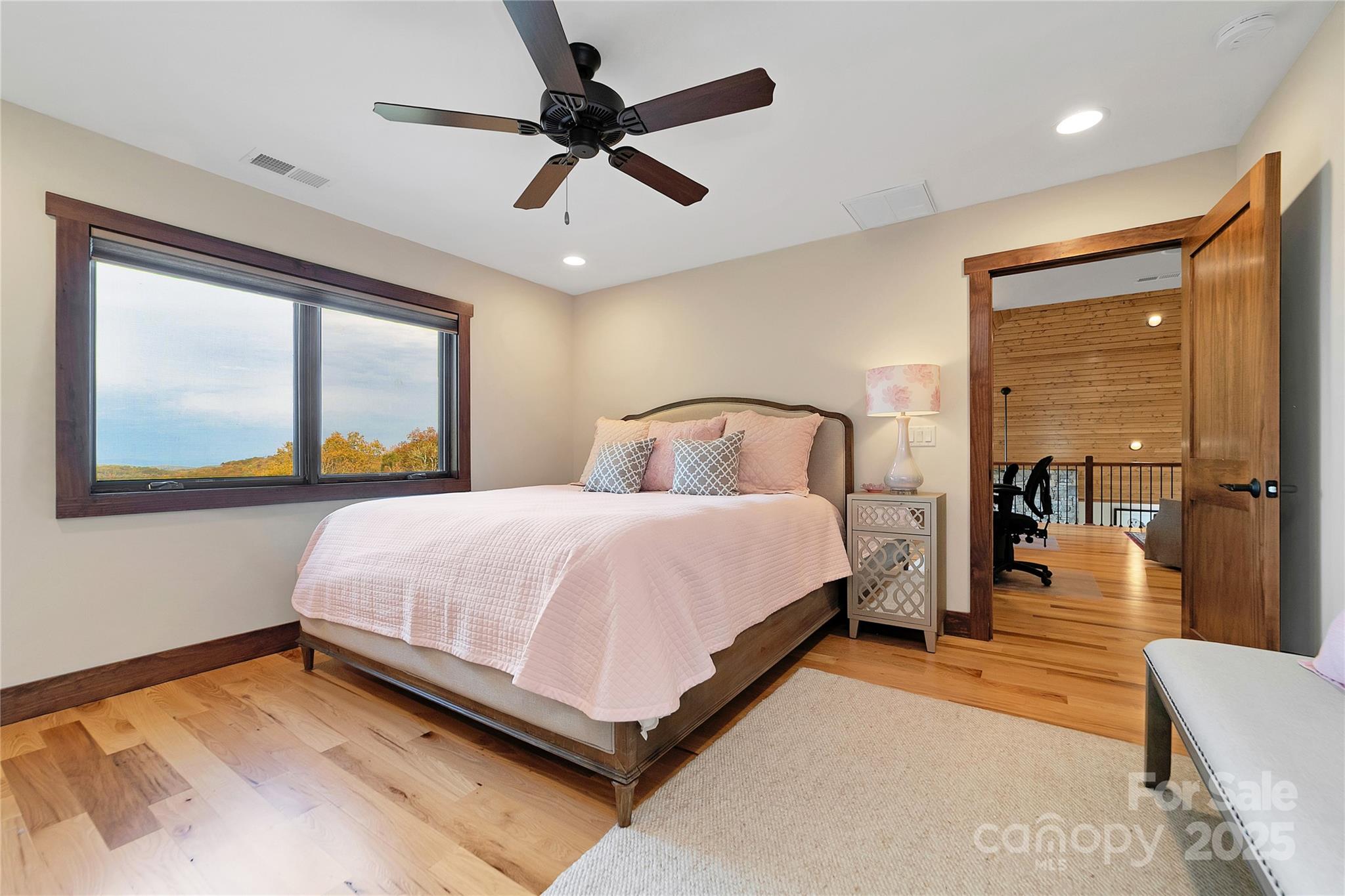 1291 Indian Camp Mountain Road Rosman, NC 28772 - Photo 29 of 48 a bedroom with a bed and a large window