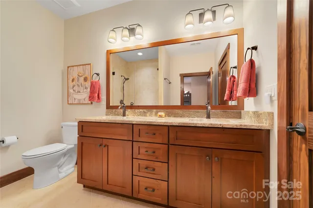 a bathroom with a shower and a toilet