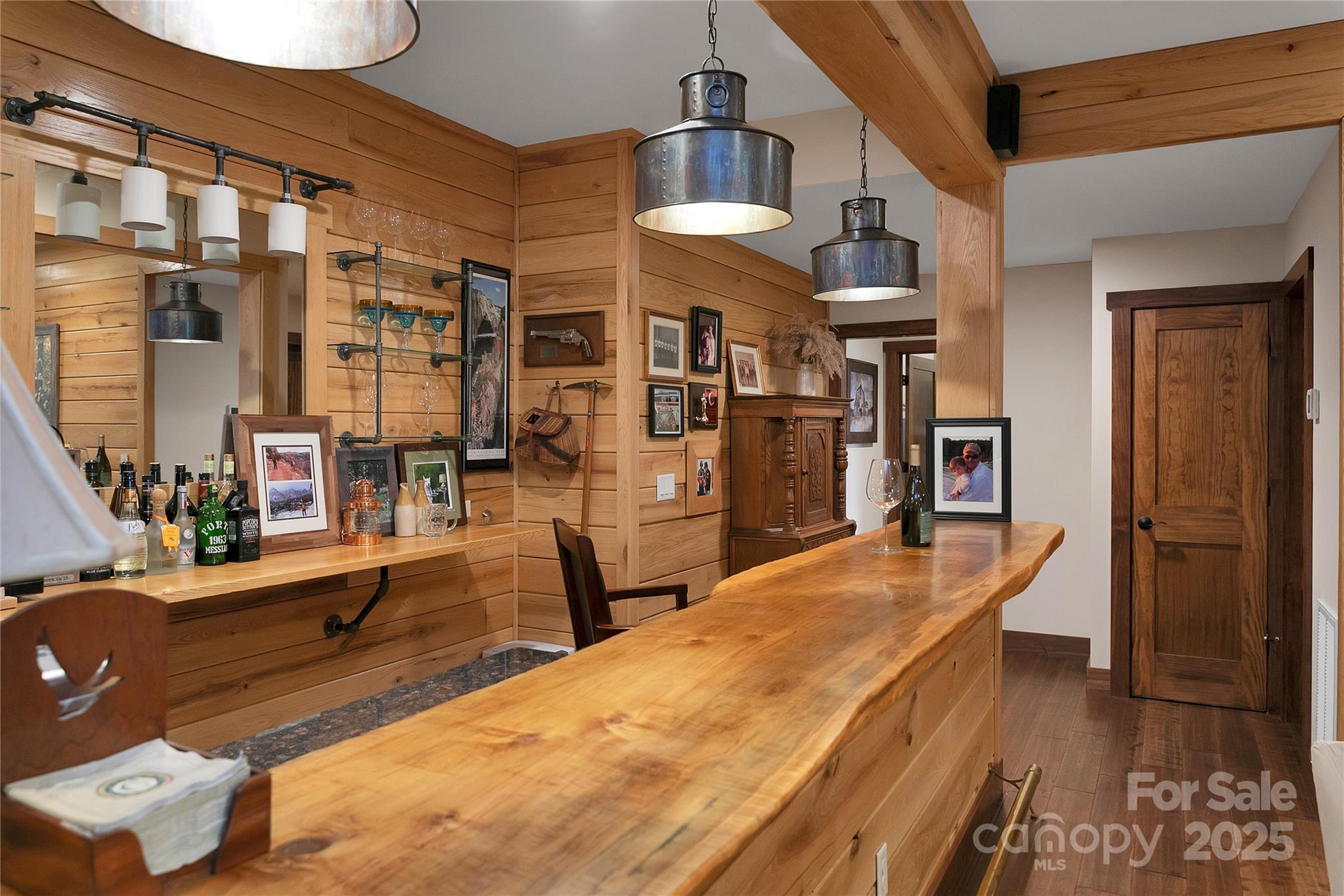 1291 Indian Camp Mountain Road Rosman, NC 28772 - Photo 37 of 48 a dining hall with stainless steel appliances kitchen island granite countertop a refrigerator and a stove