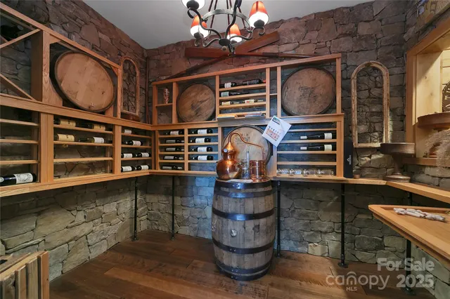a living room with furniture and view of kitchen