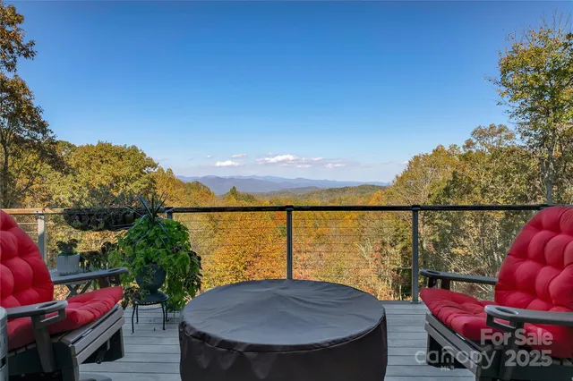 a view of a balcony with a table and chairs