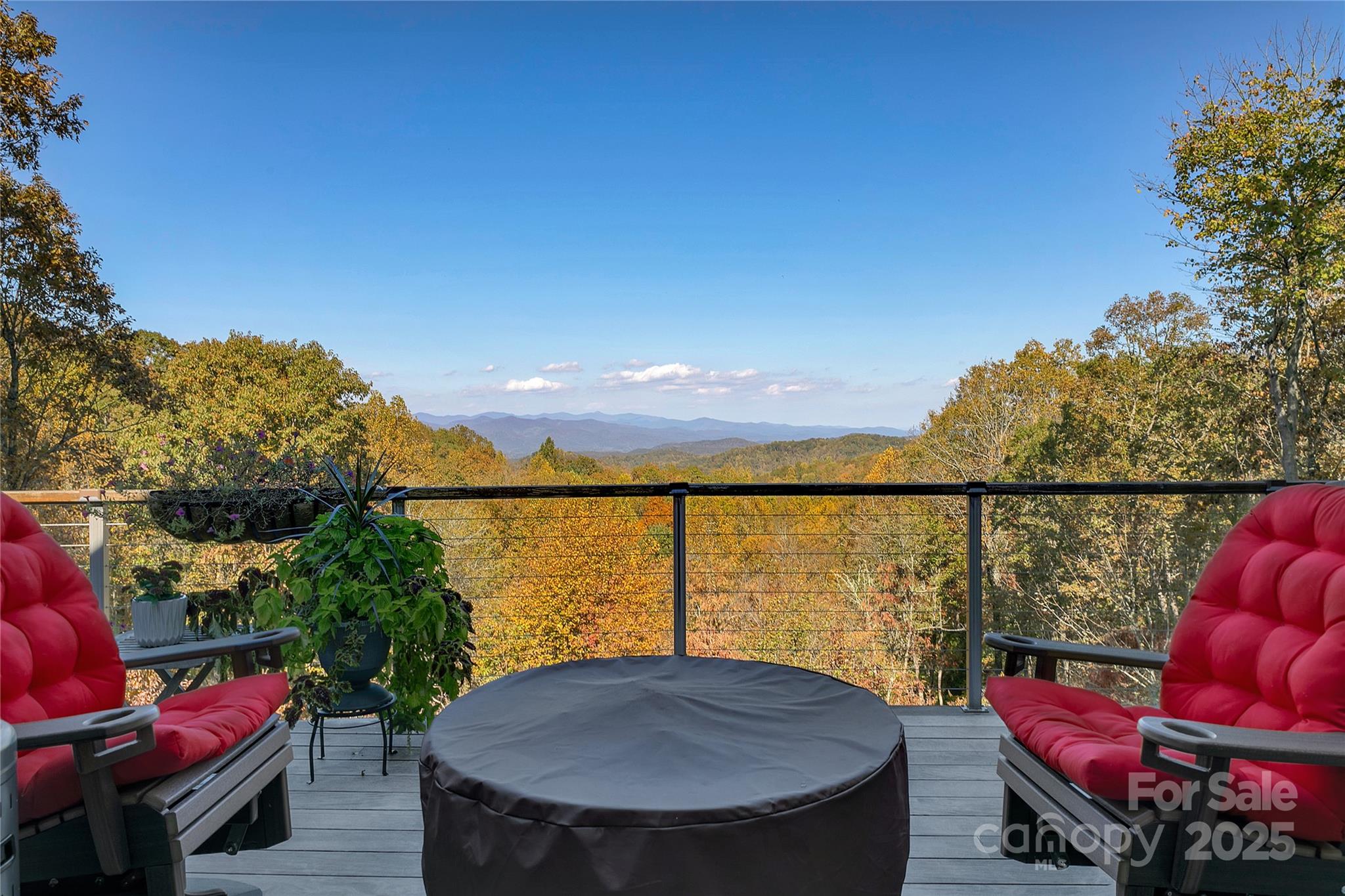 1291 Indian Camp Mountain Road Rosman, NC 28772 - Photo 4 of 48 a view of a balcony with a table and chairs