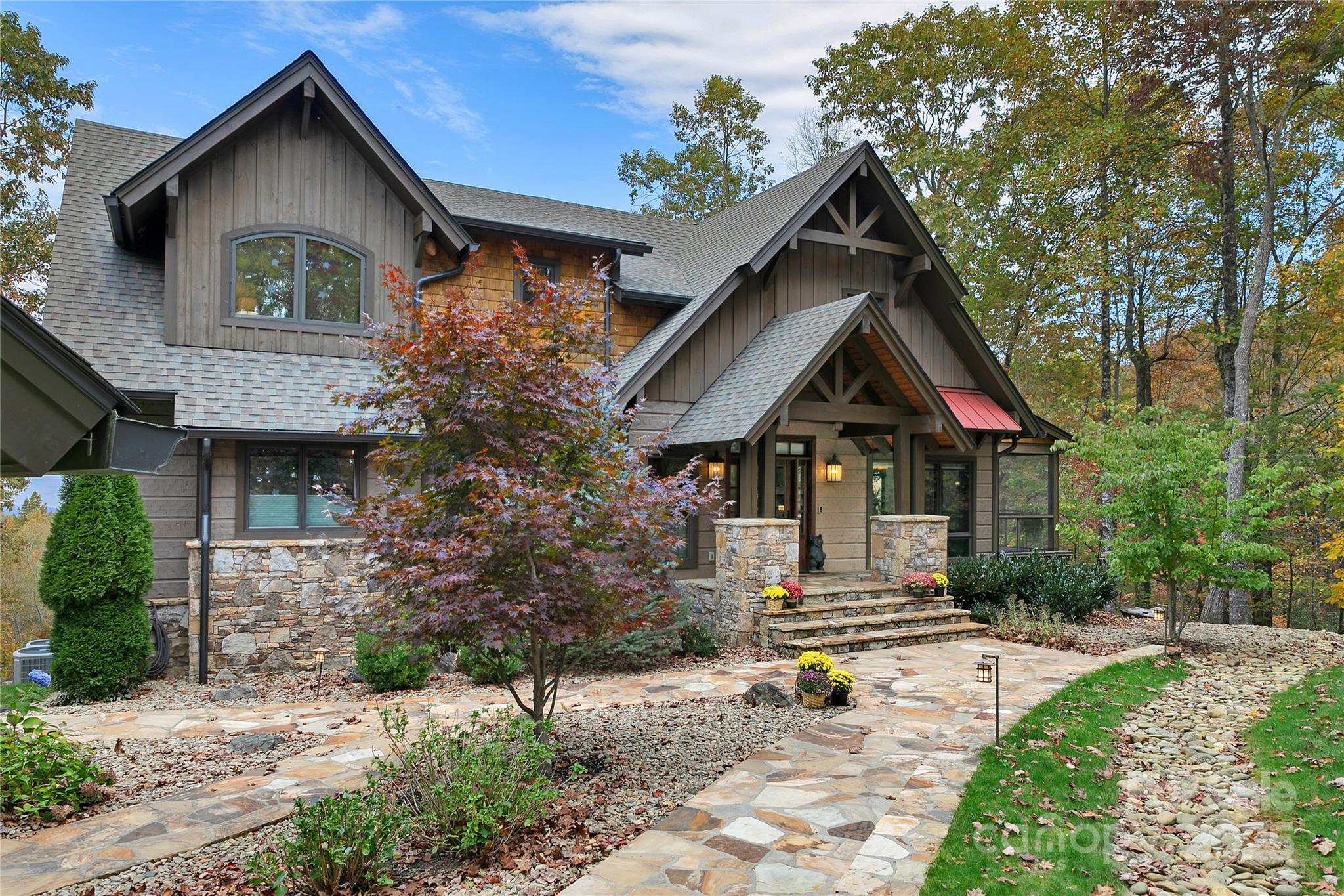 1291 Indian Camp Mountain Road Rosman, NC 28772 - Photo 5 of 48 a front view of a house with a yard