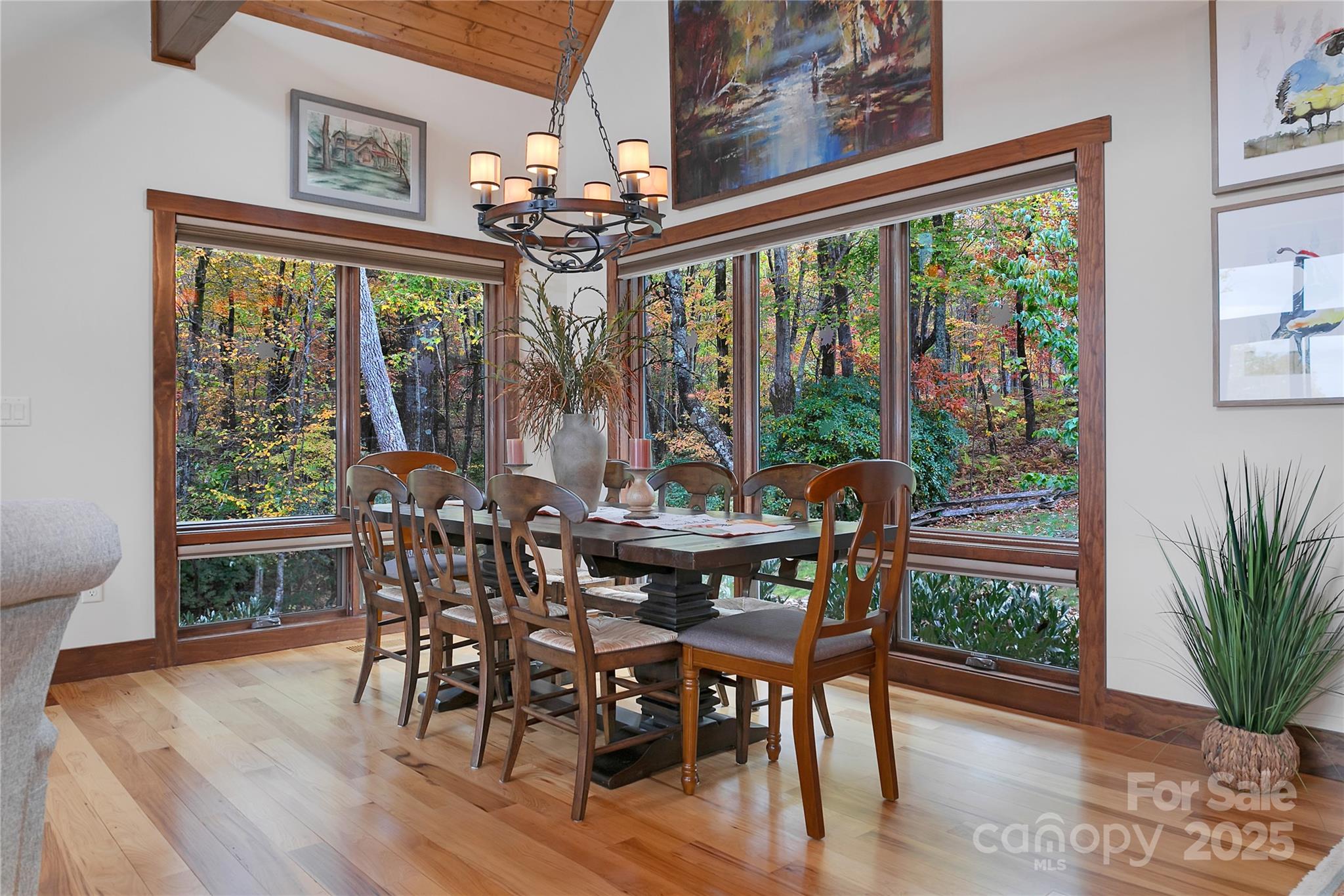 1291 Indian Camp Mountain Road Rosman, NC 28772 - Photo 9 of 48 a view of a dining room with furniture window and wooden floor
