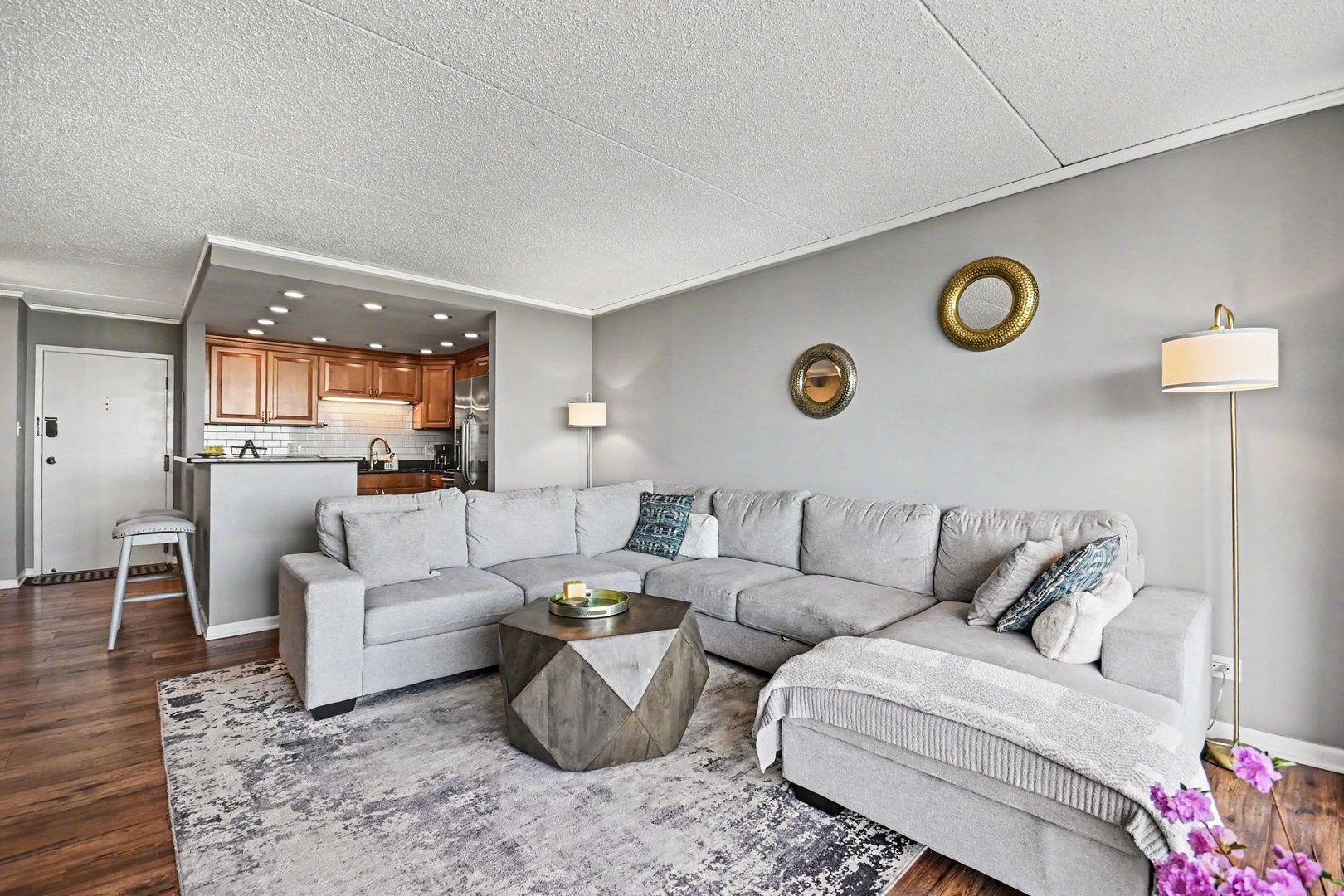 2015 South Finley Road, Unit 1107 Lombard, IL 60148 - Photo 5 of 22 a living room with furniture and a table