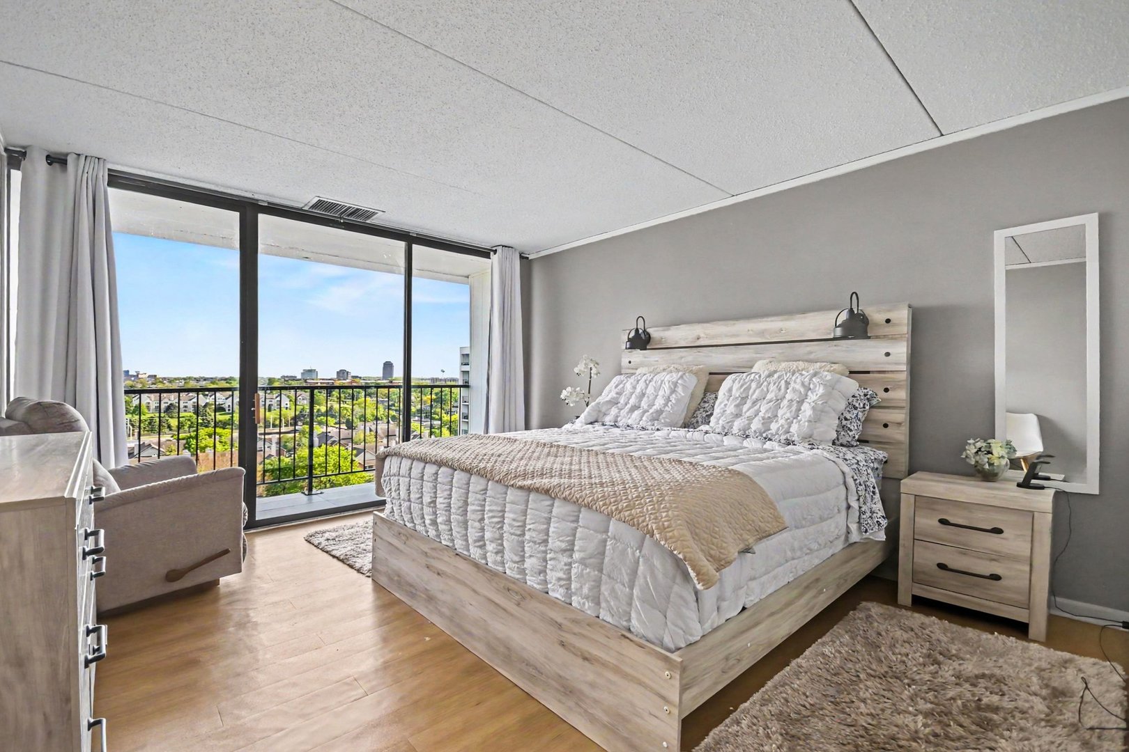 2015 South Finley Road, Unit 1107 Lombard, IL 60148 - Photo 9 of 22 a bedroom with a bed and a large window