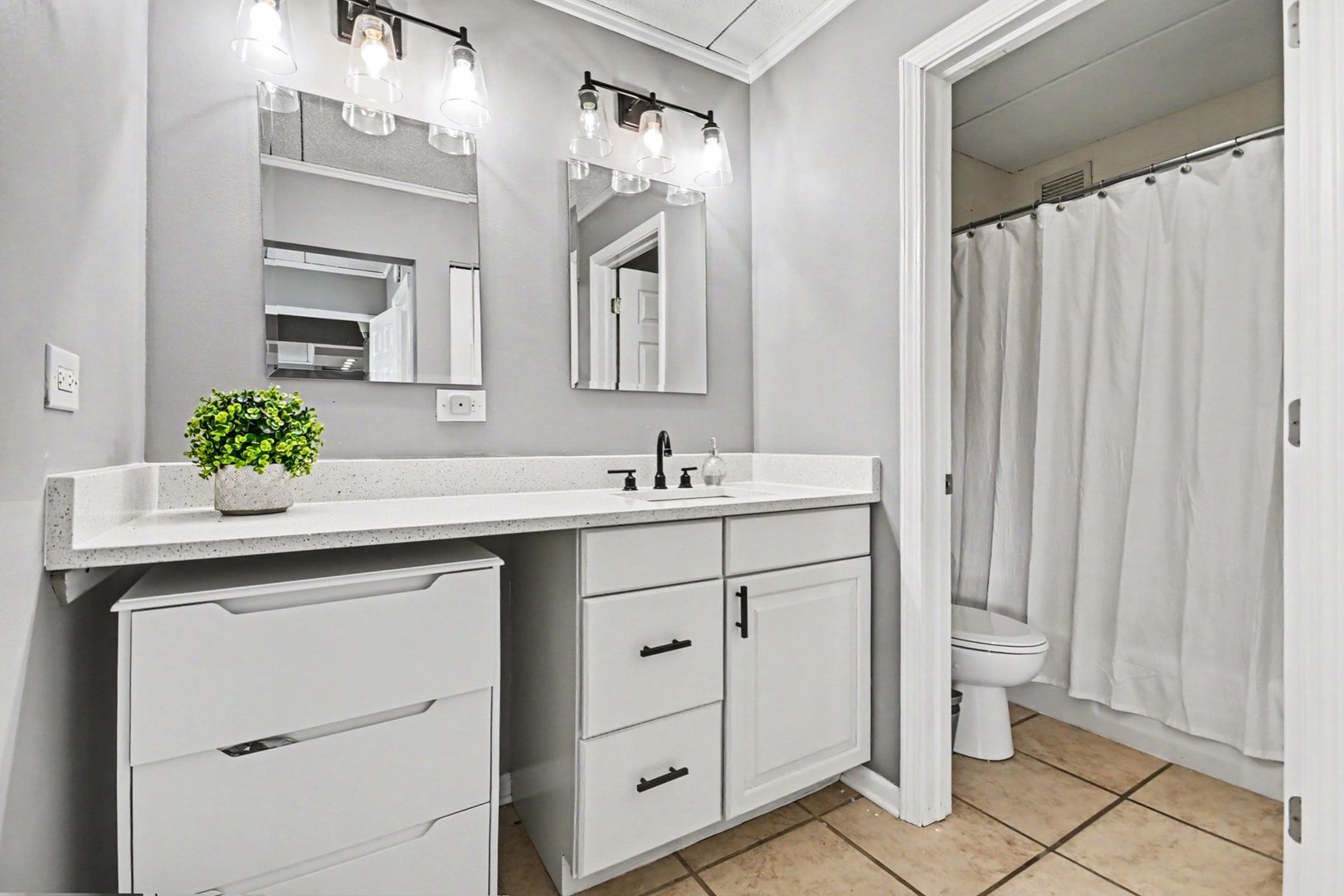 2015 South Finley Road, Unit 1107 Lombard, IL 60148 - Photo 10 of 22 a bathroom with a double vanity sink and a mirror