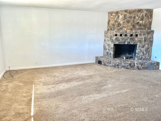 1272 North Inyo Street Ridgecrest, CA 93555 - Photo 10 of 24 a view of empty room with fireplace