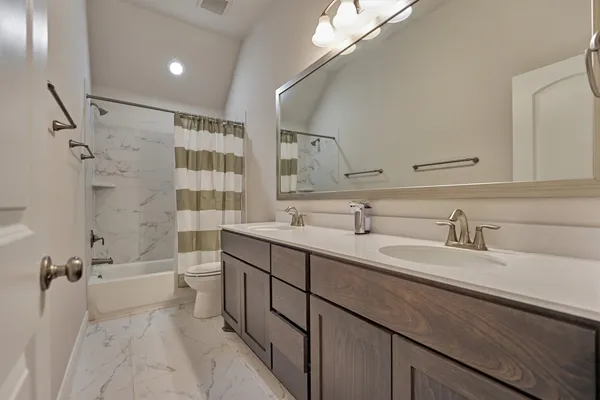 a living room with furniture flowerpot and window