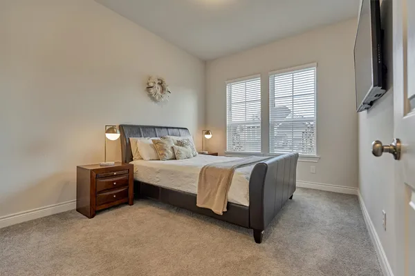 a bedroom with a bed and a view of bedroom