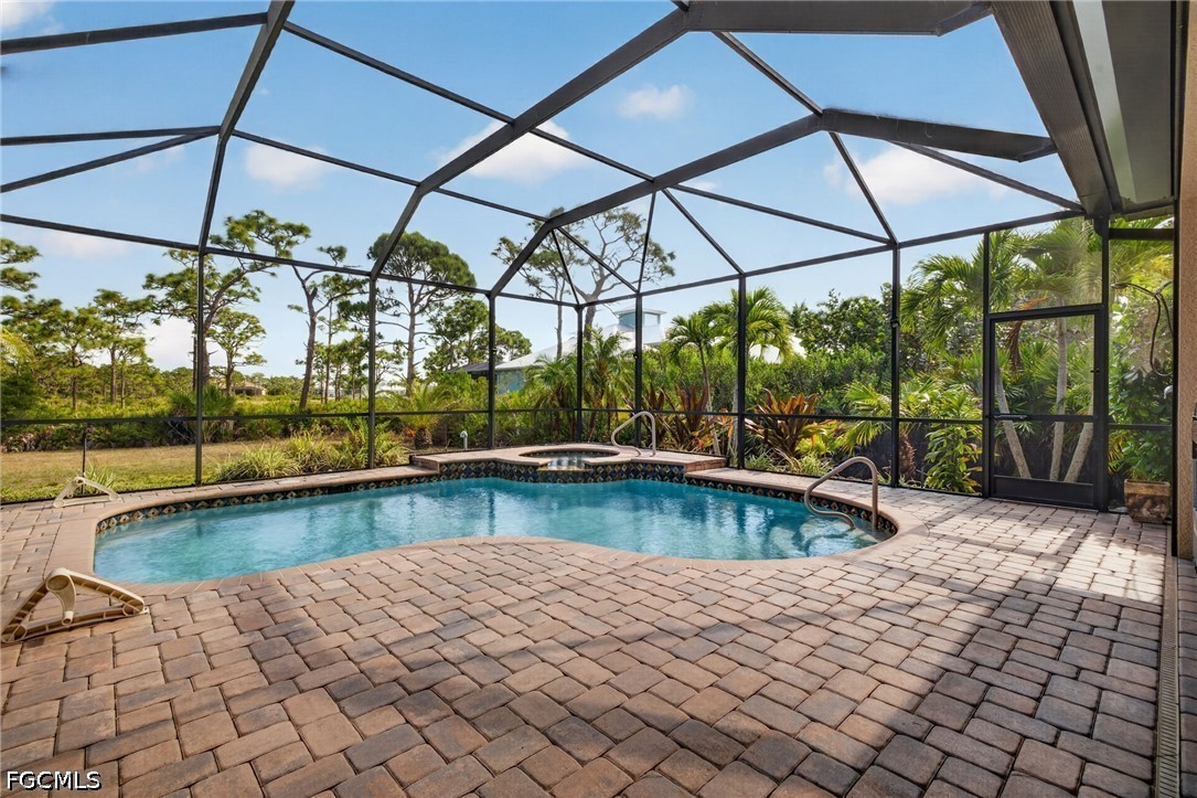 6109 Calusa Rdg Trail Bokeelia, FL 33922 - Photo 41 of 48 a view of a swimming pool with a patio