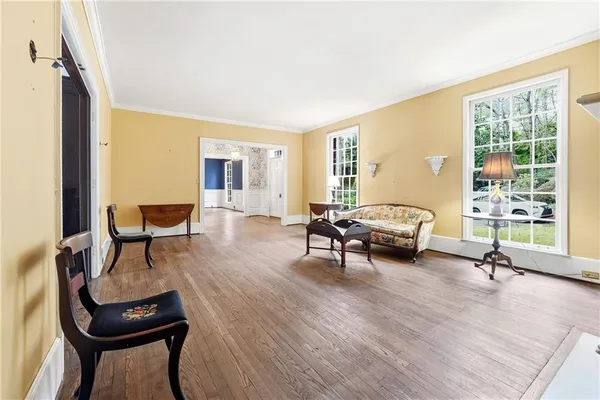a view of a livingroom with furniture and a flat screen tv