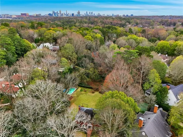 an aerial view of a house with yard porch and furniture