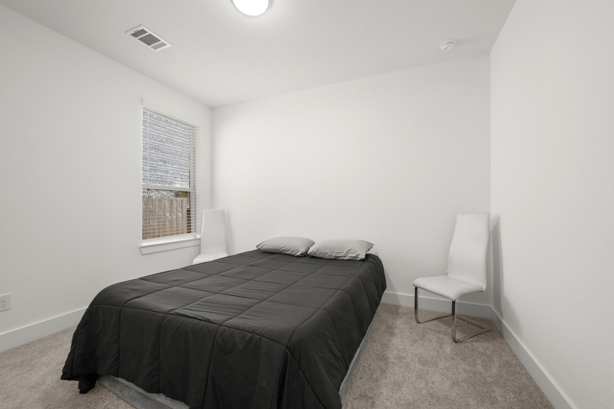 13035 Wandering Rdg Lane Conroe, TX 77302 - Photo 24 of 28 a bedroom with a bed and chair