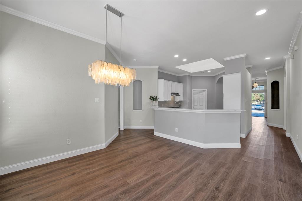 3585 Navarro Way Frisco, TX 75034 - Photo 9 of 18 On-trend paint selections and lighting create a a fresh, stylish feel throughout.