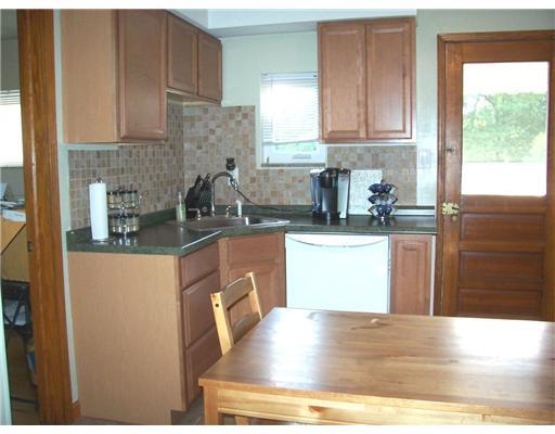 2553 Ridge Rd Extension Economy, PA 15005 - Photo 2 of 13 Kitchen. A cooks delight this eat-n kitchen has been totally updated with Oak cabinetry, new formica counters, tile backsplash, stainless steel sink and laminate flooring.