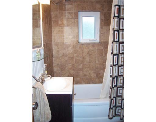 2553 Ridge Rd Extension Economy, PA 15005 - Photo 6 of 13 Other. The updated bath has wainscoting and a new tub shower combo with ceramic tile surround.