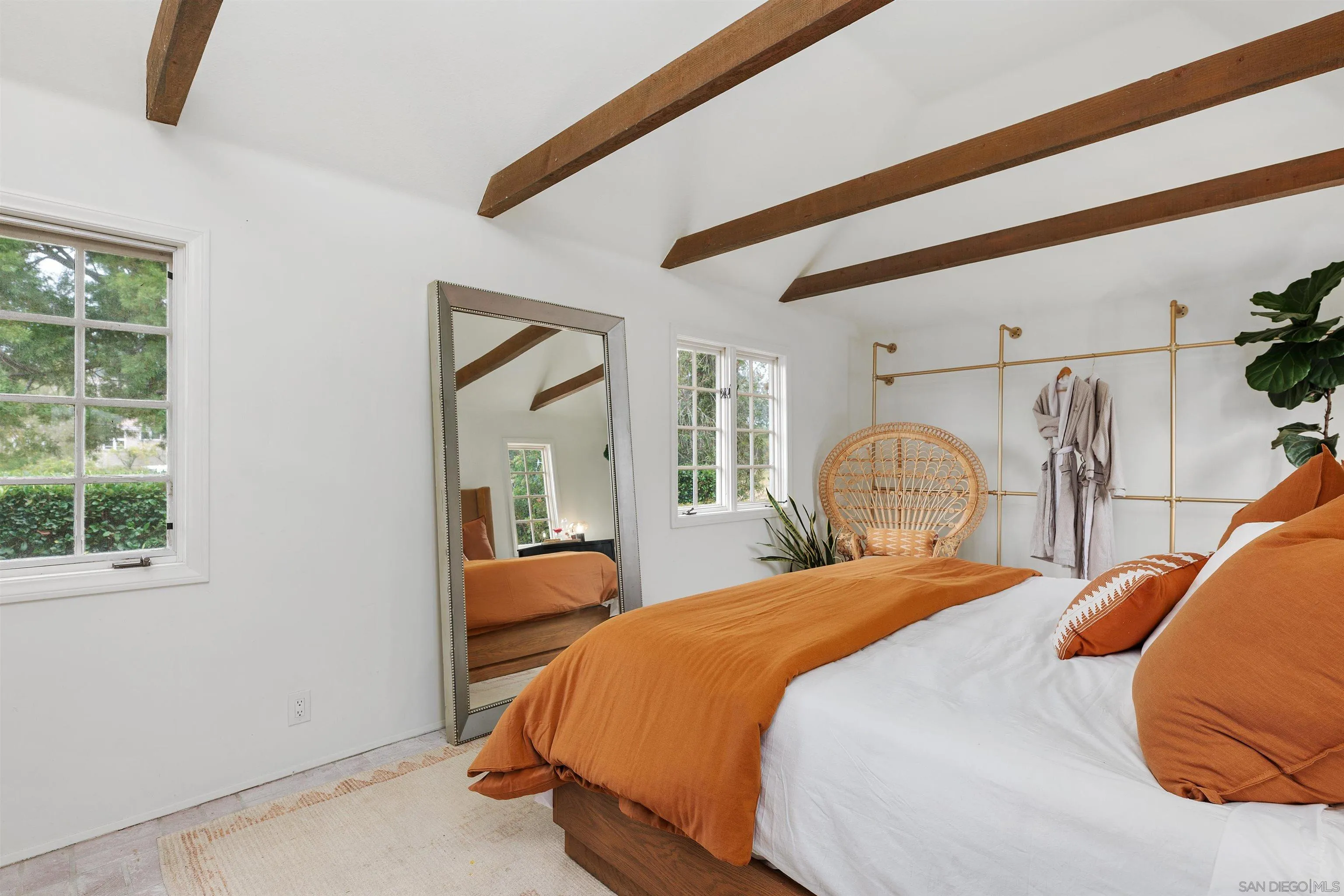 6631 Lago Lindo Rancho Santa Fe, CA 92067 - Photo 11 of 14 a bedroom with a bed and glass windows