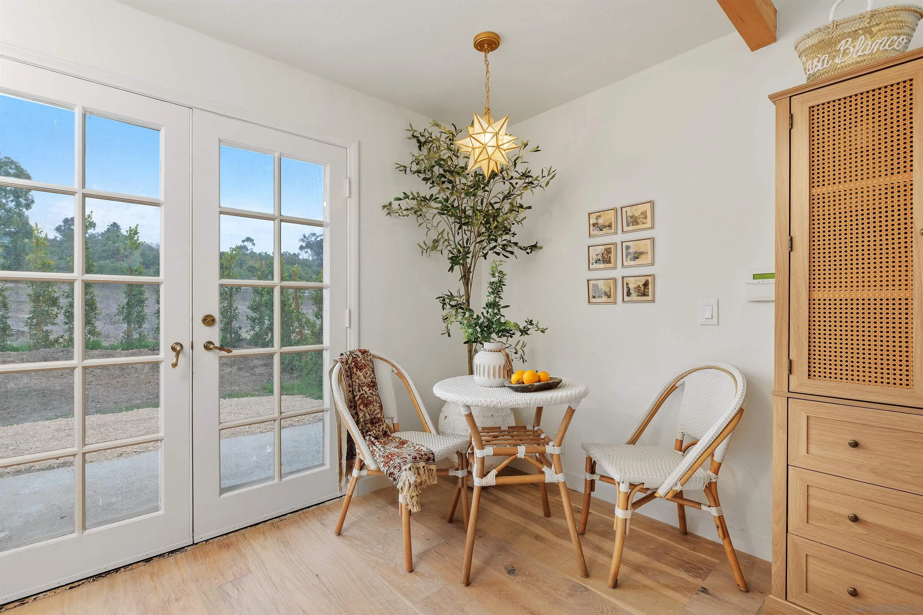 6631 Lago Lindo Rancho Santa Fe, CA 92067 - Photo 5 of 14 a view of a dining room with furniture and chandelier